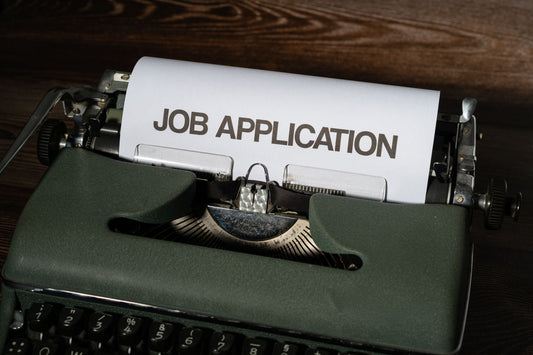 job application in typewriter