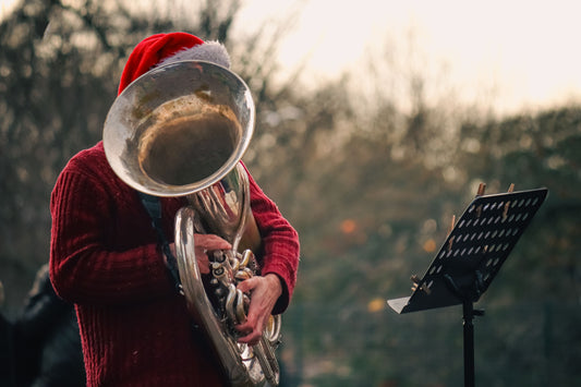 Baritone horn player with santa cap