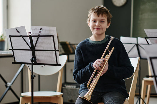 Boy holding a trumpet
