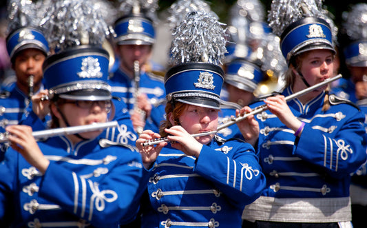 Flute players marching in a marching band