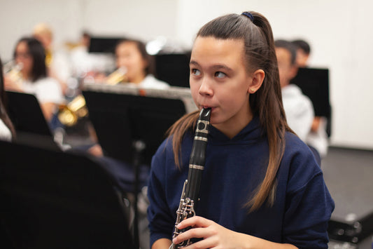 Girl Playing Clarinet in band class