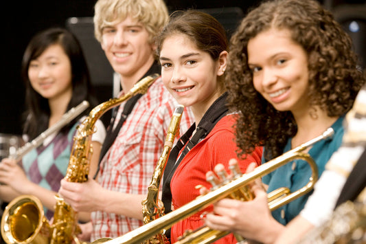 Teens playing band instruments