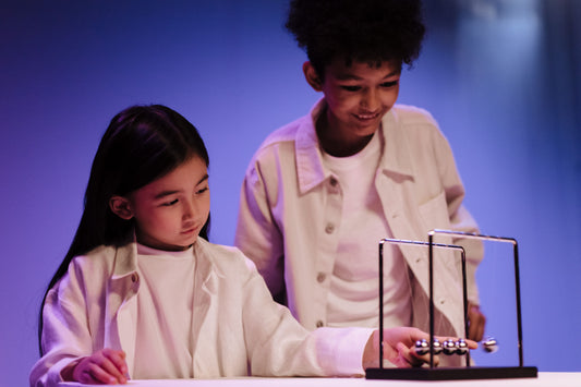 Two kids playing a science game