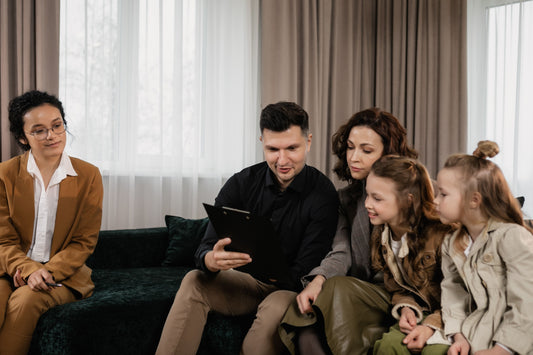 Parents and child looking at a tablet