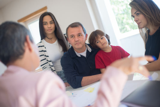 Parents with child and teacher