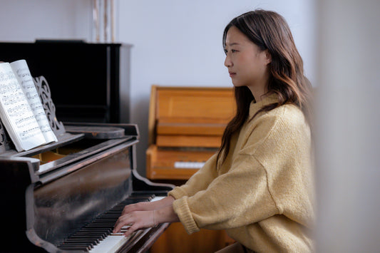 Young woman playing piano