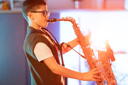 boy playing saxophone