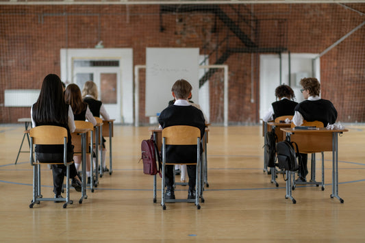 a group of students sitting quietly in class