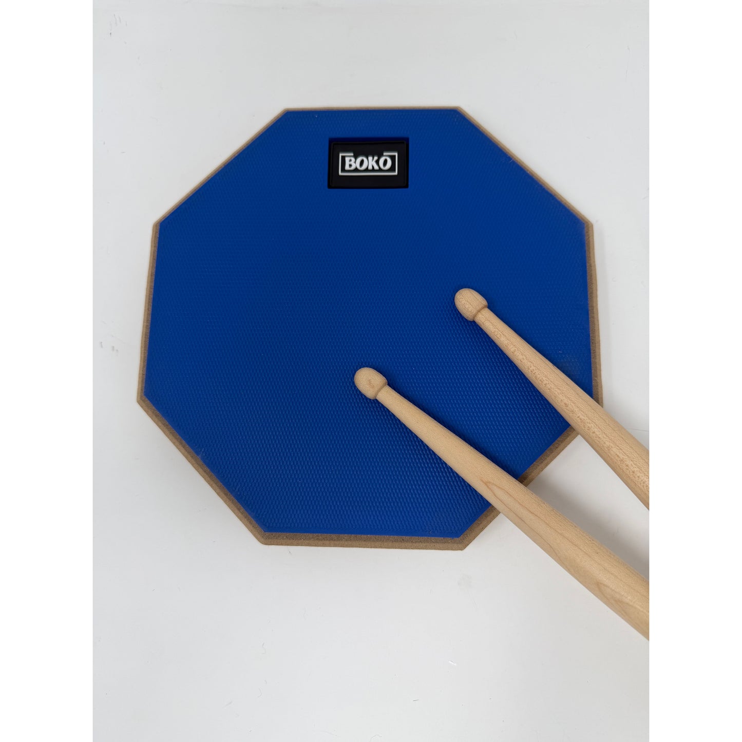 BOKO drum practice pad shown with drumsticks