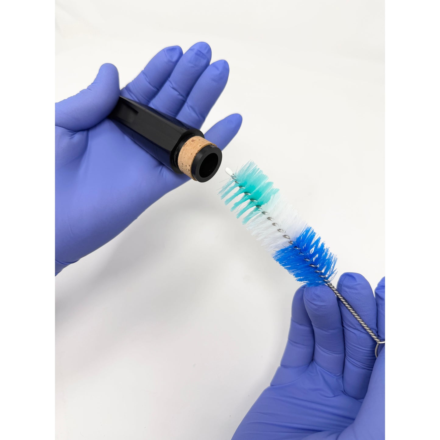Brush for cleaning a clarinet mouthpiece