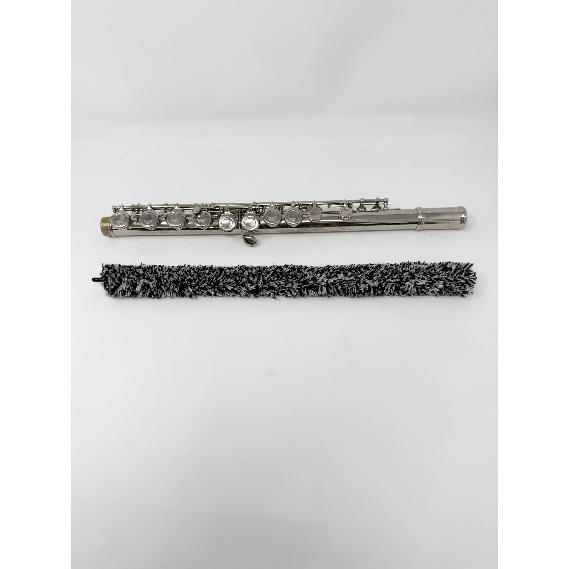 Close-up of a flute pad saver