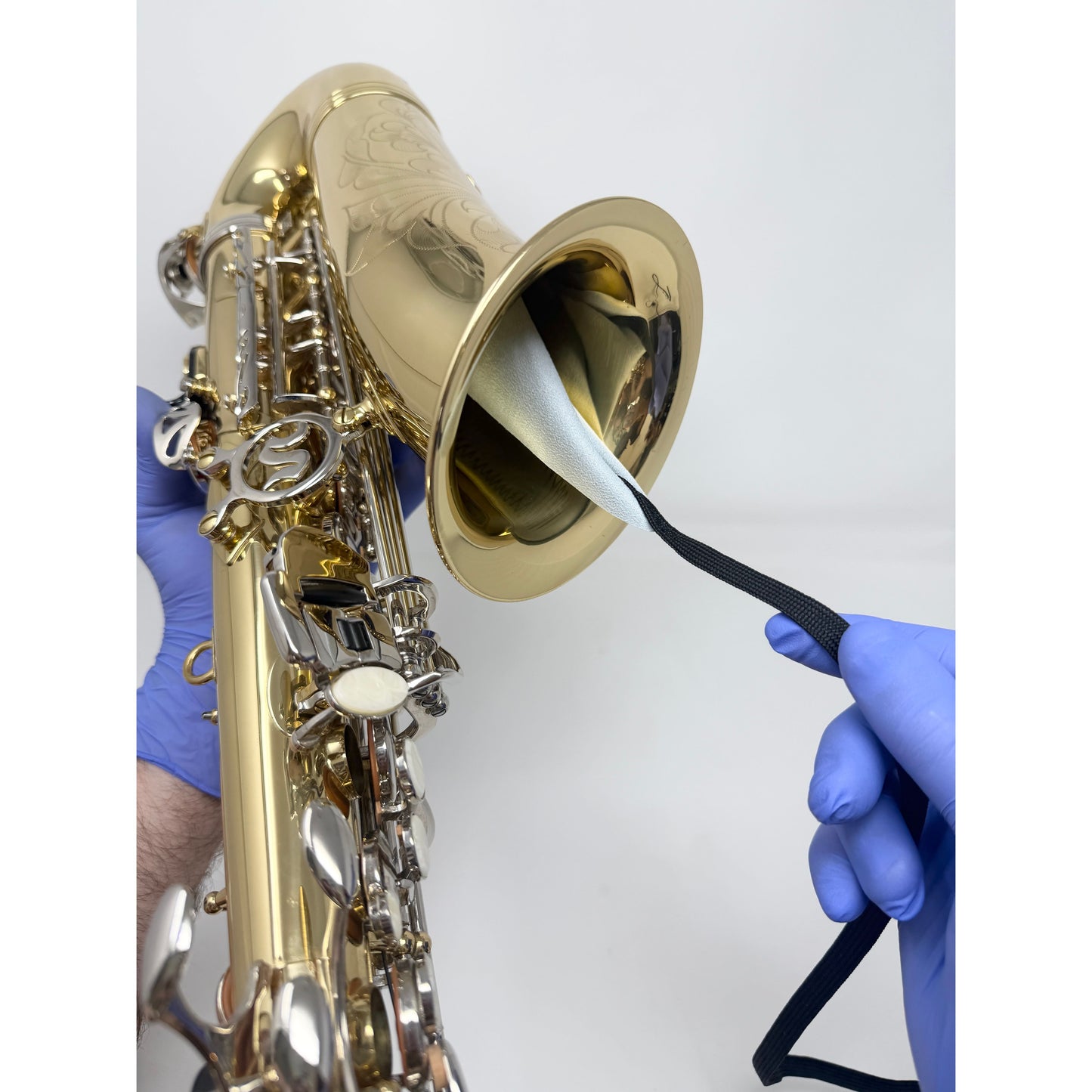 Weighted-end large saxophone swab after use